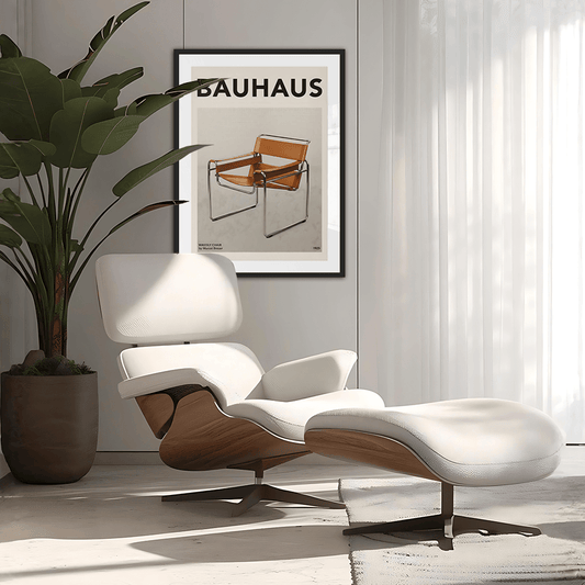 Modern white lounge chair with wooden accents in a room with a Bauhaus poster on the wall.