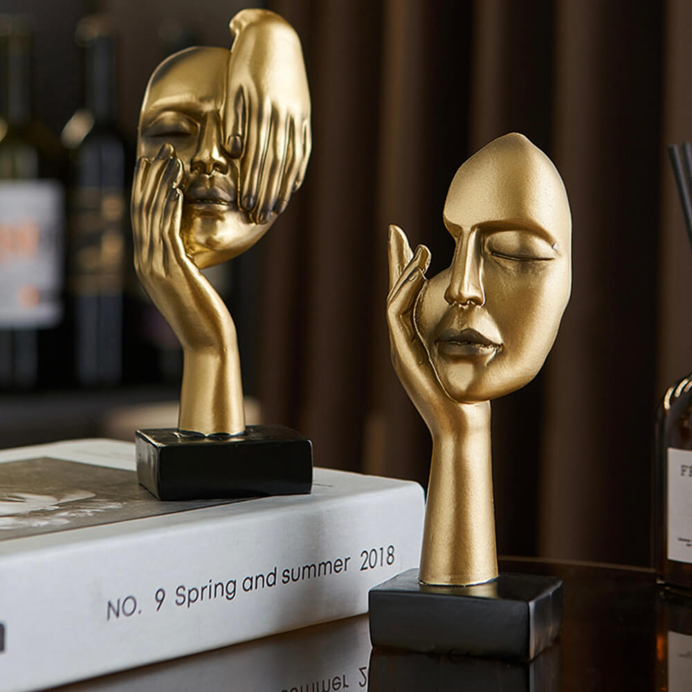 Sculptures de visage d'or