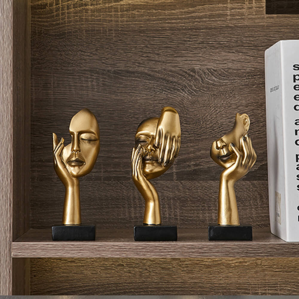 Sculptures de visage d'or