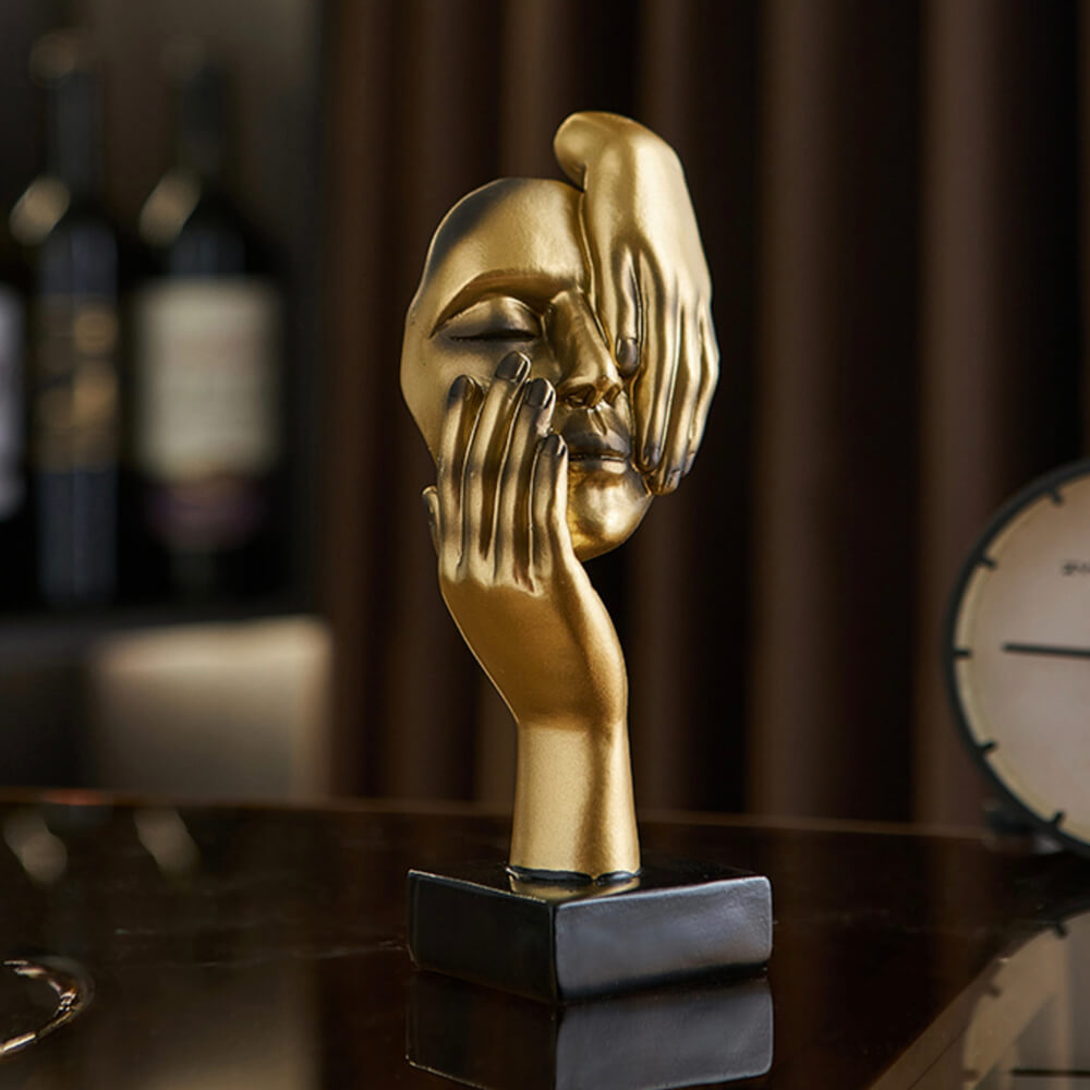 Sculptures de visage d'or
