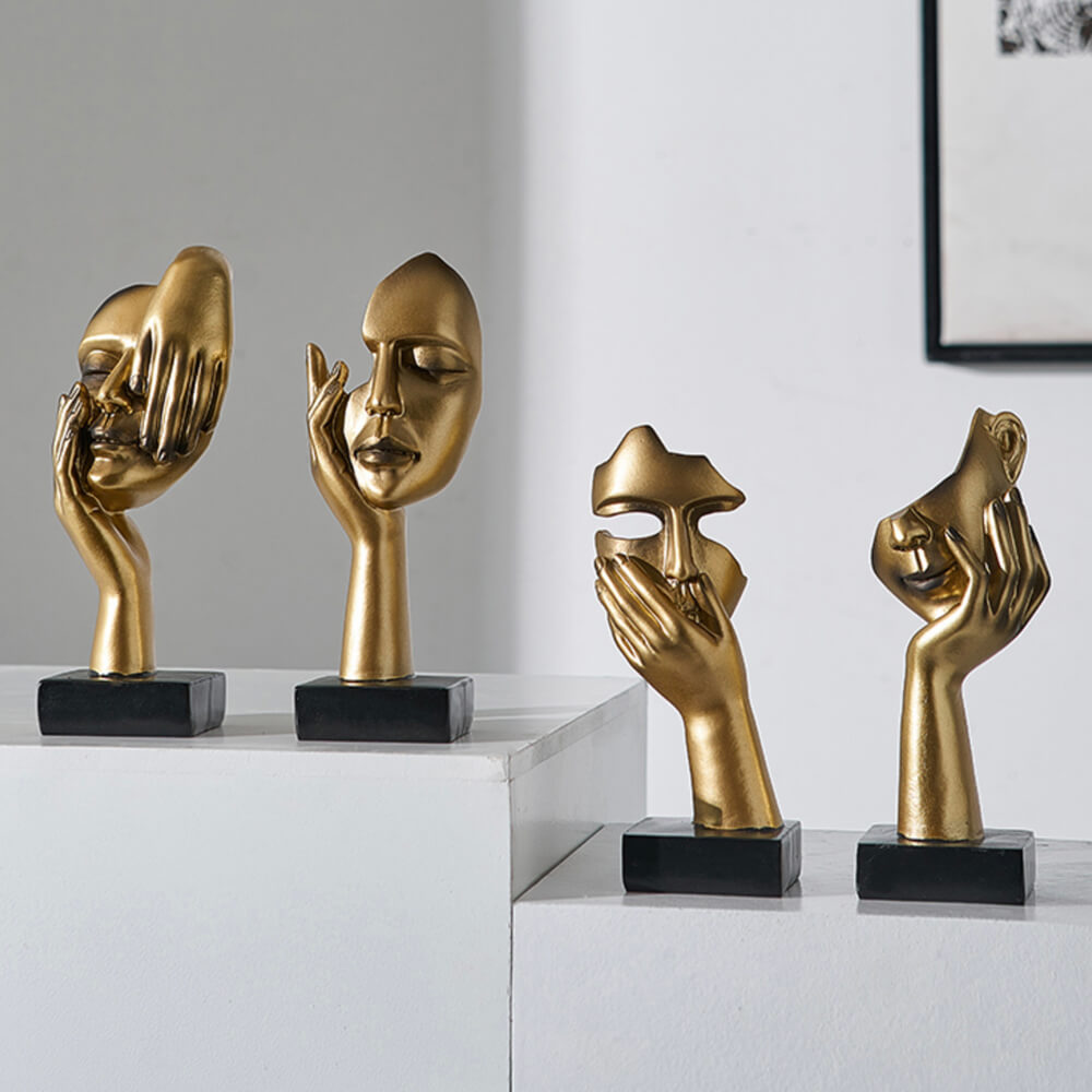 Sculptures de visage d'or
