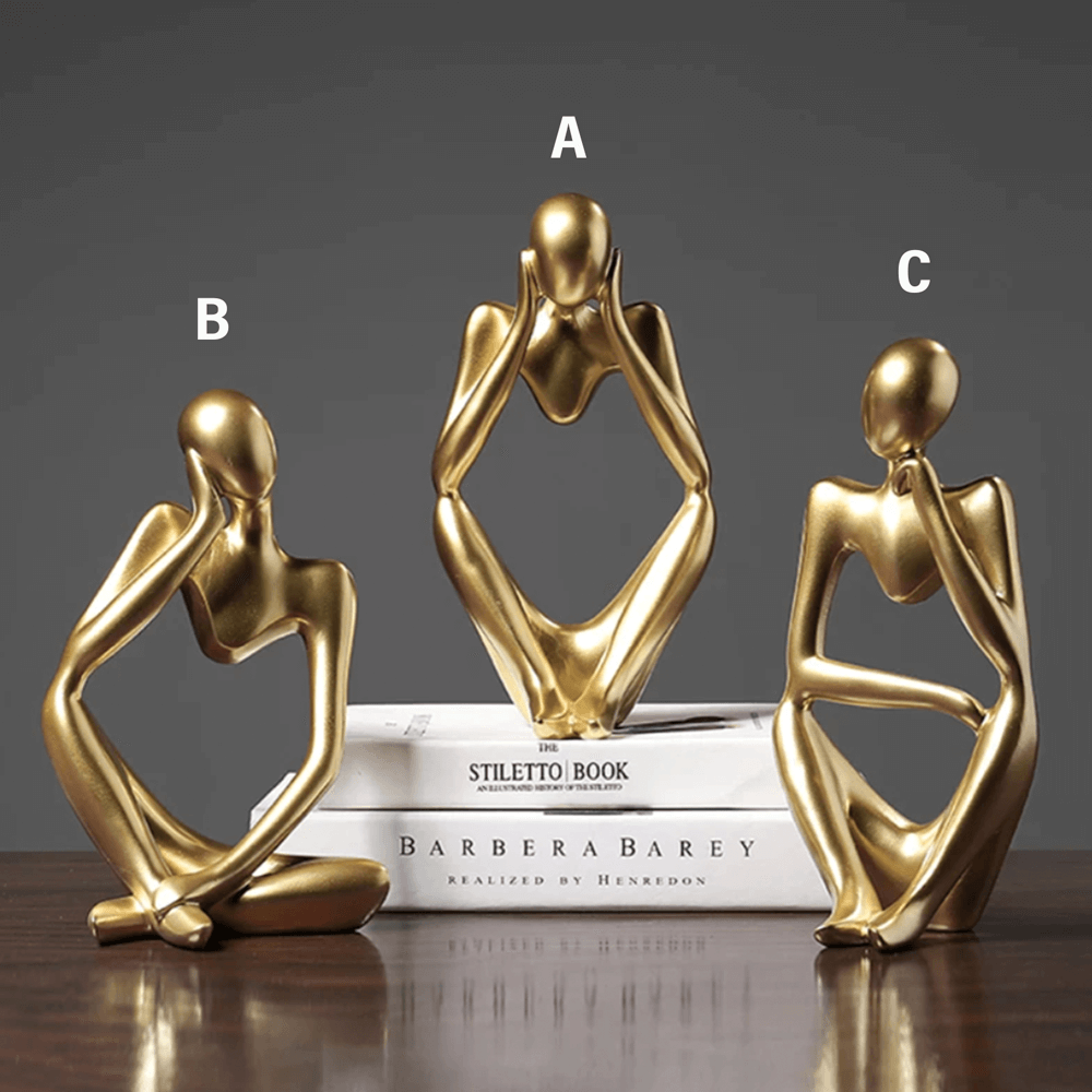 Scultura d'oro del pensatore