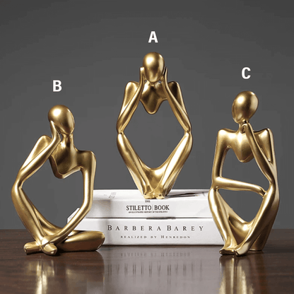 Scultura d'oro del pensatore