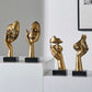 Sculptures de visage d'or