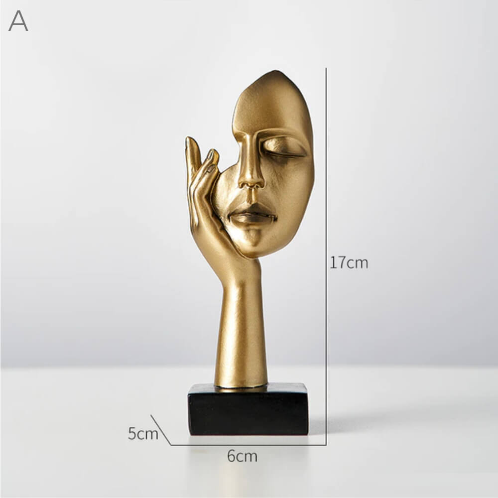 Esculturas de rostros dorados